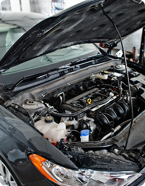 Car engine with open hood representing mobile auto service and vehicle diagnostics by Big South Performance